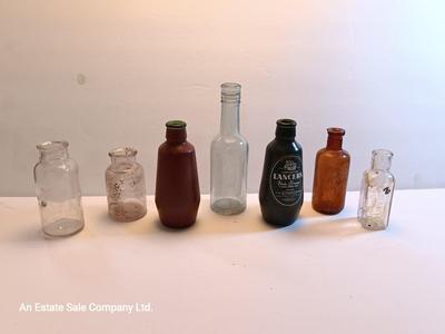 Vintage glass bottles and crock like bottles