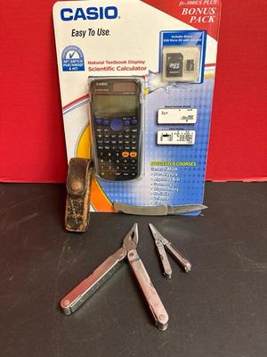 Lot 567, Casio scientific calculator, two Leatherman tools, and one buck knife