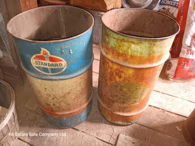 Two small Steel barrels -- standard and green faded - 27" x 14.5"