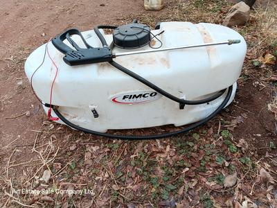 Working Fimco pesticide spray tank with high flo gold series pump and wand four-wheel mount