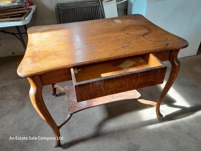 Antique two-tiered table with a drawer