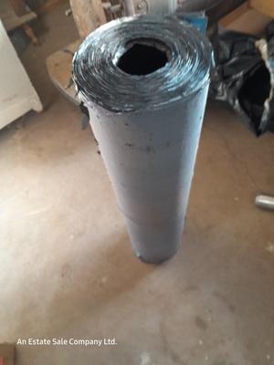 Roll of roofing material with 2 additional rolls of roof repair