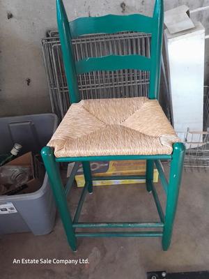 Green Ratton woven seat barstool.