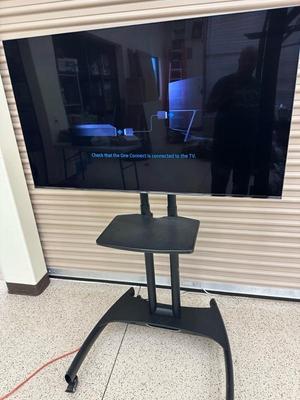 Lot 834 Samsung 55 inch SUHD smart tv model UN55KS800DF mounted on rolling north Bayou stand