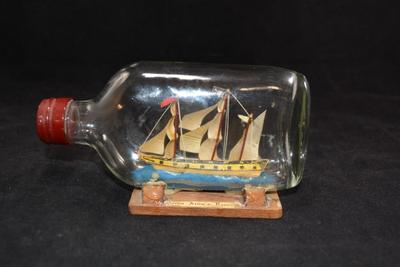 Small Vintage â€œQueen Anneâ€™s Revengeâ€ Ship In A Bottle 6x3.5