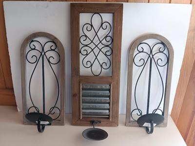 Three wood framed Metal accent candle wall sconces.
