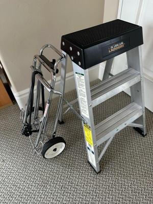 Lot 1082 gorilla step ladder, and rolling luggage cart
