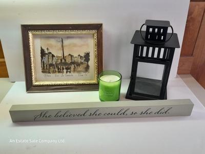 Framed picture - metal lantern - fall scented candle and "She believed she could, so she did" decor.