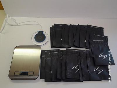 Digital food scale - POM Gear Phone charger - and a few smart stash brand bags.