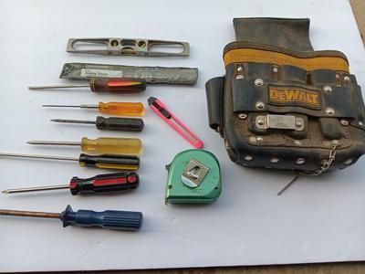 Dewalt tool bag with an assortment of hand tools - screwdrivers and more