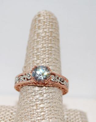 Size: 9Â½ Rose Gold Plated Ring with Round Cut Cubic Zirconia and 2 Smaller Stones on Each Size (5.1g)