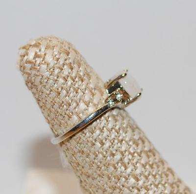 Size 6Â½ Oval Cut Lab-Style Opal Ring with 2 Clear Accent Stones (3.9g)