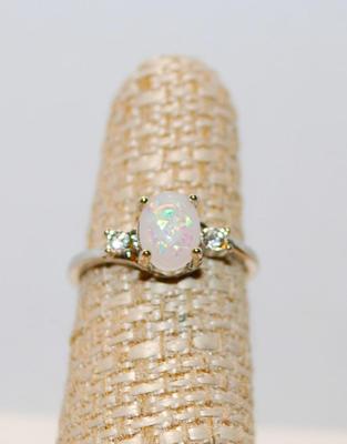 Size 6Â½ Oval Cut Lab-Style Opal Ring with 2 Clear Accent Stones (3.9g)