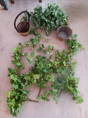 Faux ivy vines with basket of faux greenery and two wicker baskets