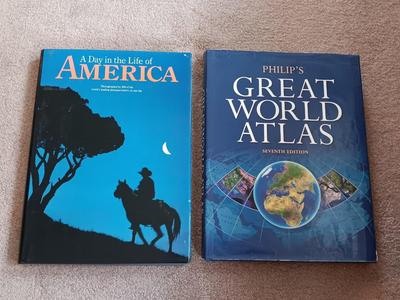 Two coffee table books - Great World Atlas and A Day in the life of America