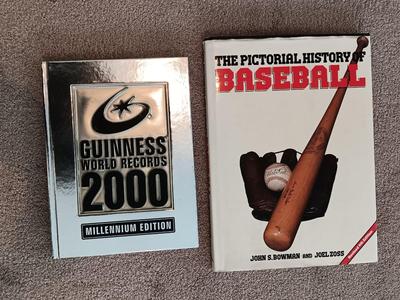 Two coffee table books - Guinness World Records 2000 Millennium edition and The Pictorial History of Baseball