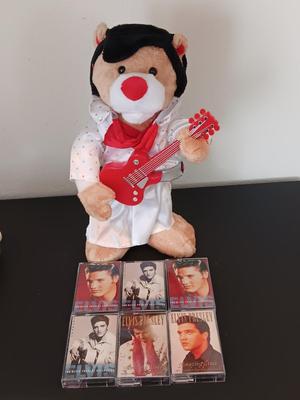 Plush Elvis singing bear with Elvis cassettes and other cassettes.