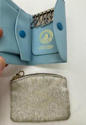 Zippered small bag for rosarie and light blue leather wallet for keeping track of keys with instructions