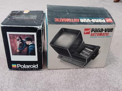 Polaroid Sun 660 Autofocus camera with original box and a Pana-Vue Automatic slide viewer