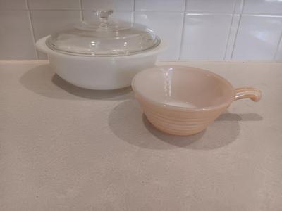 White pyrex bowl with glass lid and an orage luster Fireking handled soup bowl