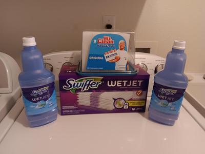 New Swiffer wetjet cleaner and pads and a partial box of Mr. clean magic erasers