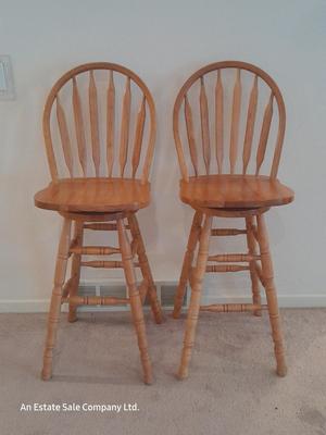 Two nice oak high back swivel bar stools