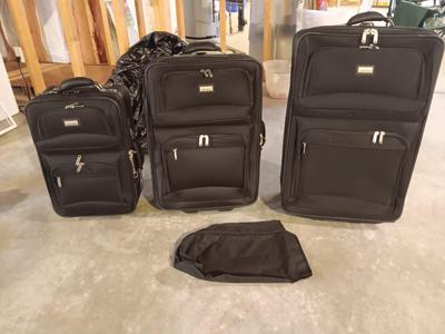 Nice nesting 3-piece PROTOCOL suitcase set with pull along handles - 3 different sizes.
