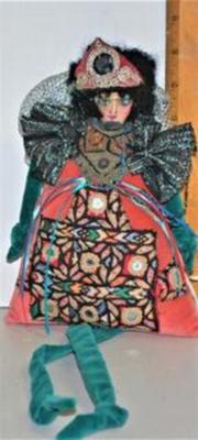 Small Very Colorful and Oddly Dressed Doll