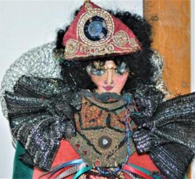 Small Very Colorful and Oddly Dressed Doll