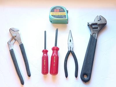 Grouping of hand tools and a tape measure