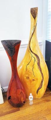 CLOSE UP OF HANDCARVED WOODEN VESSELS