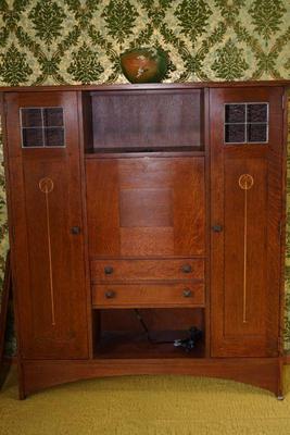 Stickley brand oak sideboard that is lighted. 
This is a more contemporary piece very well made. Excellent condition. 