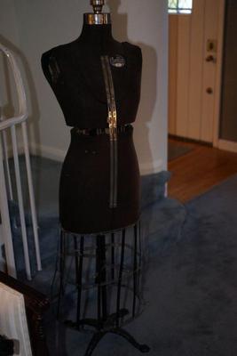 very nice early 1900' dress form with cast iron footed base.