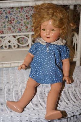 This is an early Shirley Temple doll. 1934-5