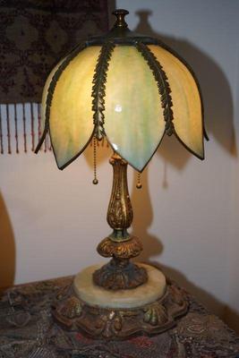 Lovely unique antique slag glass pedal shade lamp with three light settings. on marble and ornate base.