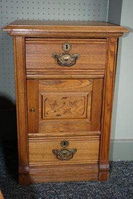 early 1900'a oak chifforobe cabinet with spoon carving on the door.