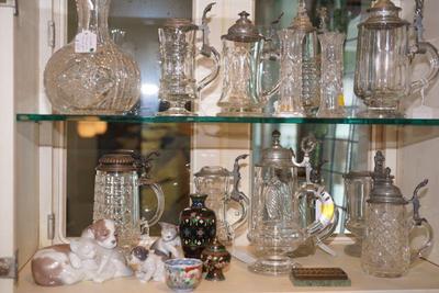 collection of glass steins. Some are antique with pewter engraved lids and cut glass stein. 