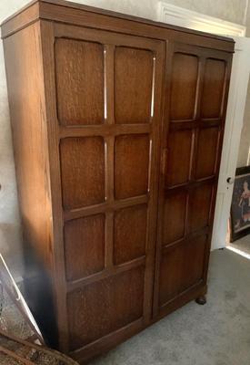 This 1930’s  paneled quarter sawn oak wardrobe is made by and  labeled Waring & Gillow, historic English cabinetmakers known for...