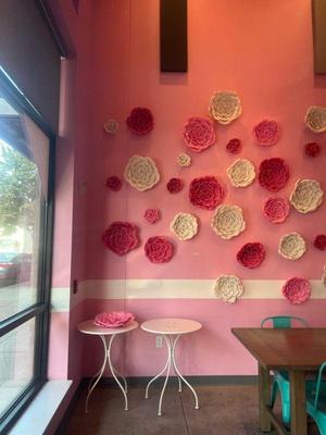 Wall flower decorations & 2 white 23" round tables 