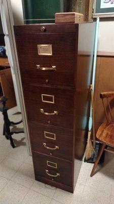 Globe Wernicke metal file cabinet with old folders inside