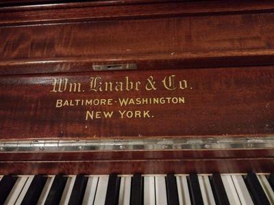 an upright grand is a name to large upright pianos with strings and sound board as large or larger than a baby grand