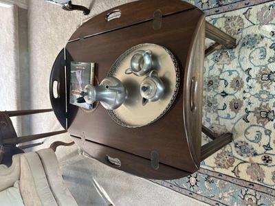 Coffee table with fold down leaves