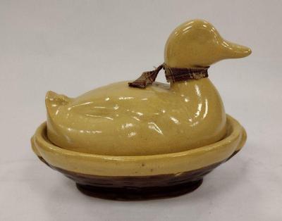 Yellow ware pottery duck on nest