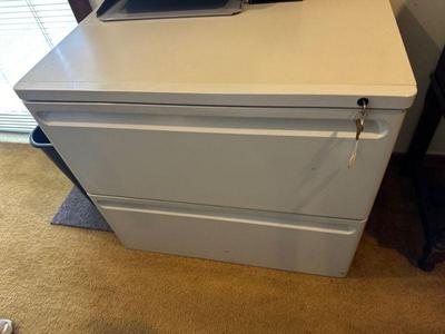 Lateral file cabinet with lock