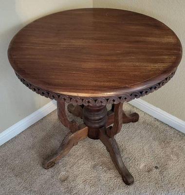 Antique carved wood round table