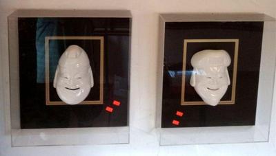 Porcelain Korean masks in Plexiglas cases 