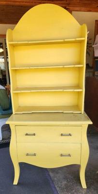 Pretty two piece that could be painted to match anyone's room or stripped.  Nice as it is but is marred a bit on the top. 