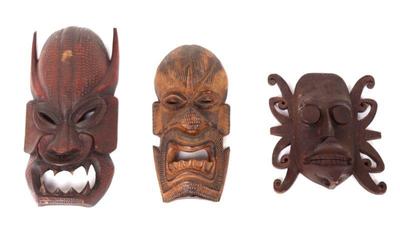 Lot 338 group of tibetan and dayak wood carved masks