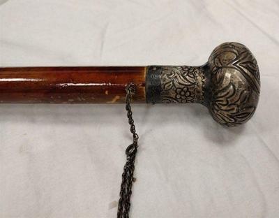 CARVED CANE WITH 900 SILVER REPOUSE' HANDLE