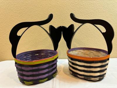Two longaberger baskets with wooden cat handles